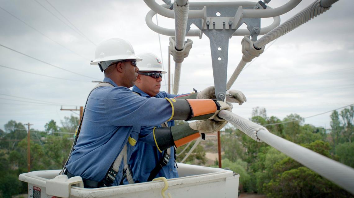 SDG&E team members replace wooden poles with fire-resistant steel ones